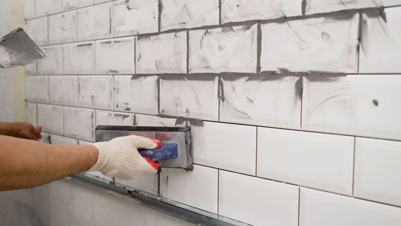 Skilled Tile Installer at Work
